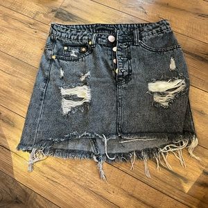 Women’s black distressed denim skirt